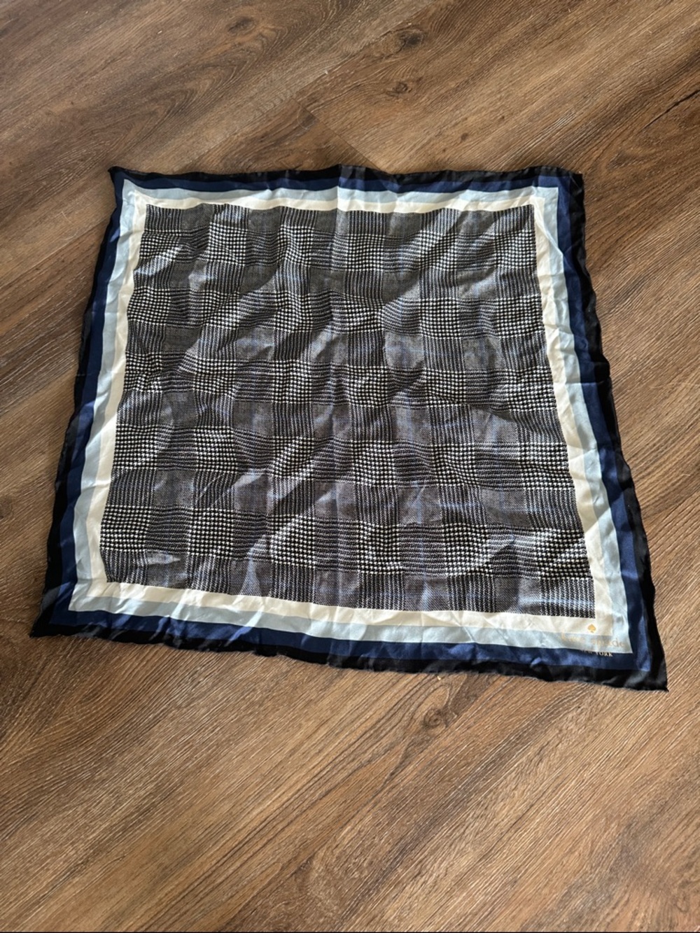 Kate Spade Gold Logo on Navy, Black, and Cream Patterned Scarf